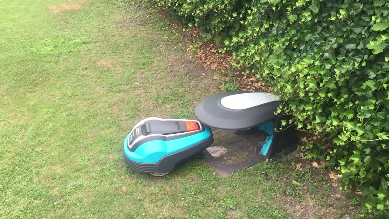 Robotic mower docking at its charging station