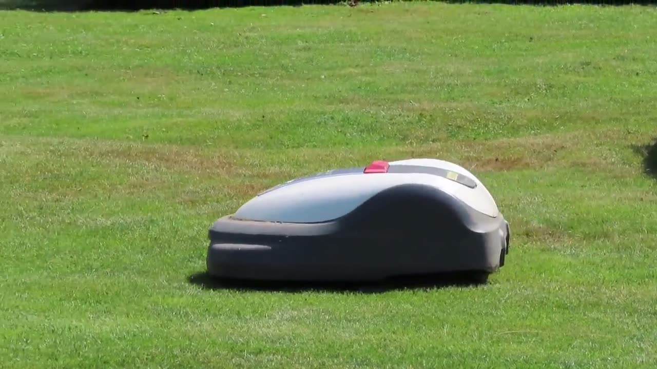 Robotic mower quietly mowing a lawn